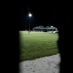 Bubby Williams game winning home run as seen through a knot hole in the left field fence